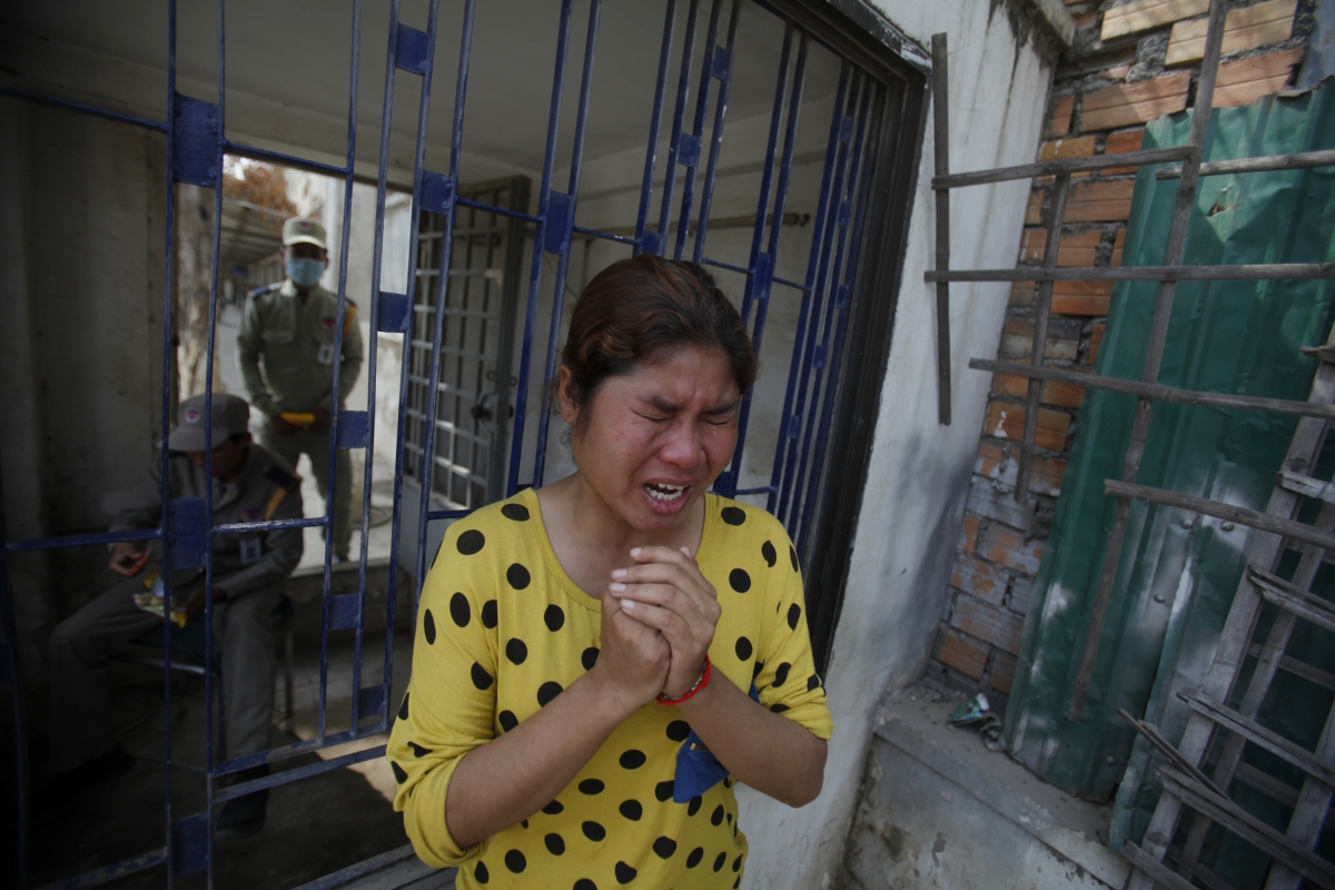 A garment worker cries after clashes broke out during a protest in Phnom Penh Cambodia garment workers
