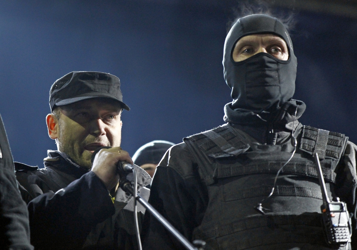 Dmytro Yarosh (L), a leader of the Right Sector movement, addresses during a rally in central Independence Square in Kiev