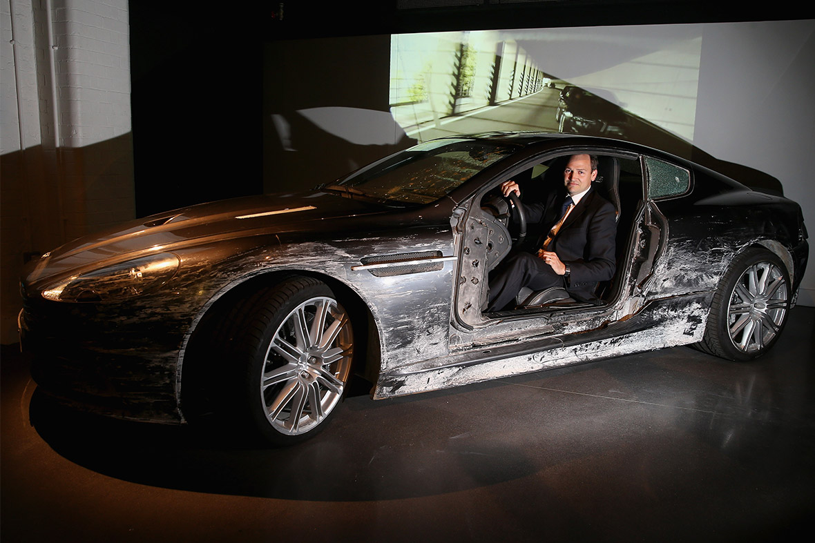 Ben Collins, stunt driver for Daniel Craig, poses with the Aston Martin DBS from Quantum of Solace