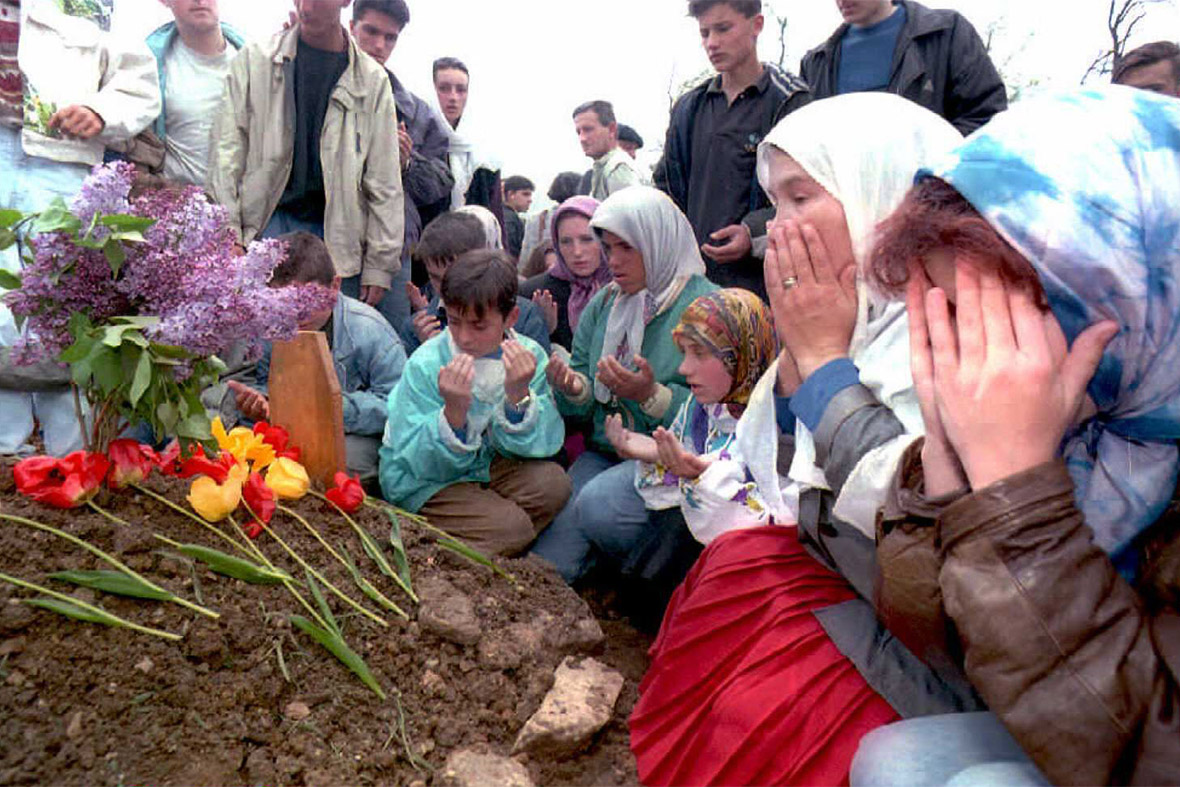 6 May 1995: Friends mourn during the funeral of 17-year-old Amel Hodzic who was shot by a sniper in Sarajevo