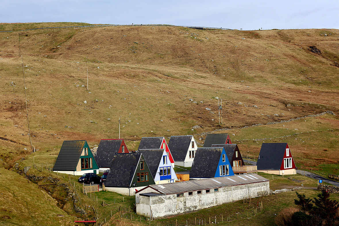 Scandinavian-style houses stand in a remote glen on the Shetland Islands houses