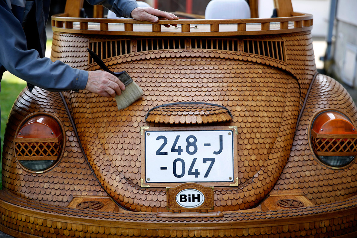Momir Bojic, 71, cleans his wooden Volkswagen Bee   tle in f   ront of his home in Celinac, near Banja Luka, Bosnia