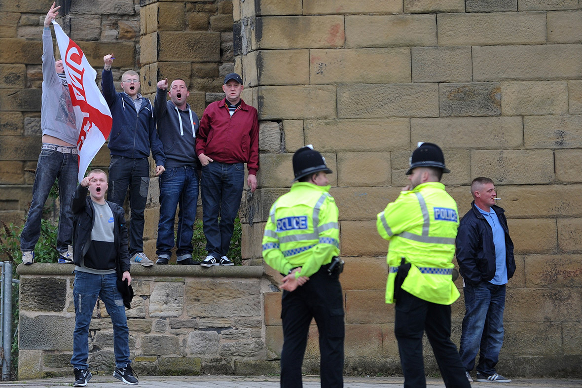 EDL supporters chant before the start of a meeting where Nigel Farage ...