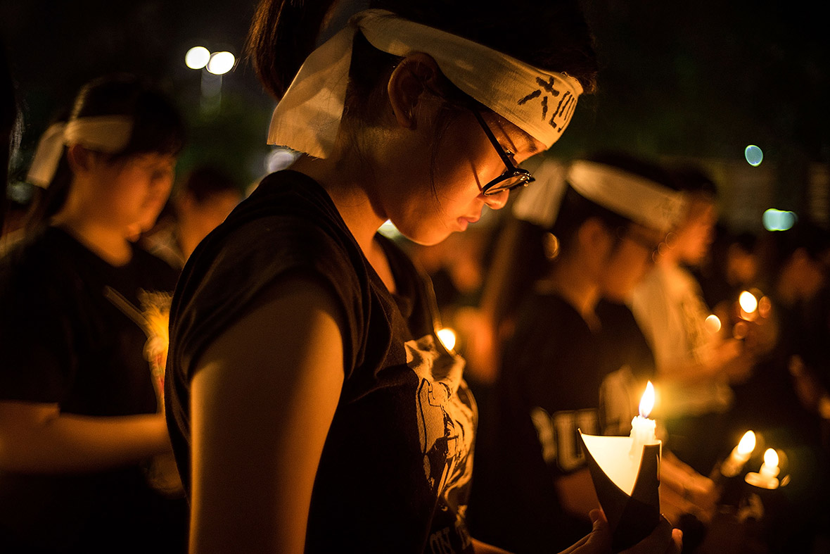 People take part in a candlelight vigil in Hong Kong - the only commemoration of the event on Chinese soil