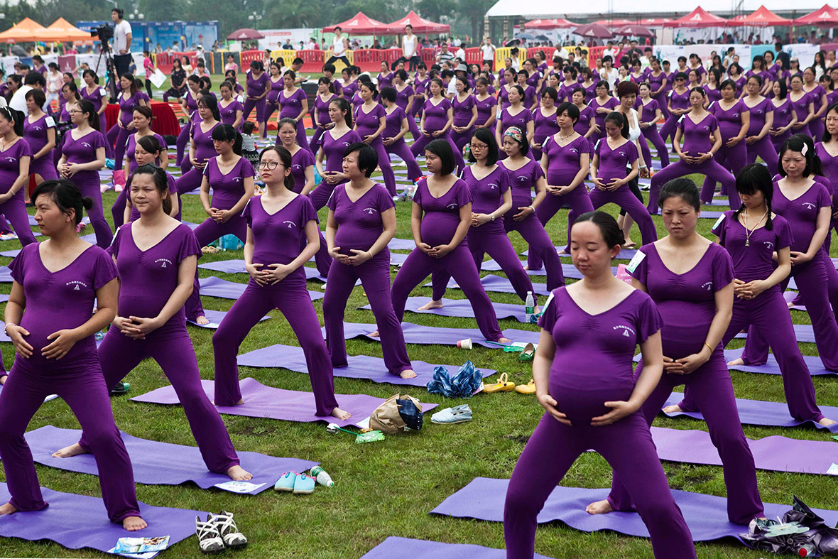 Pregnant women practice yoga as they attempt to break the Guinness World Record for the largest prenatal yoga class, in Changsha, Hunan province, China.