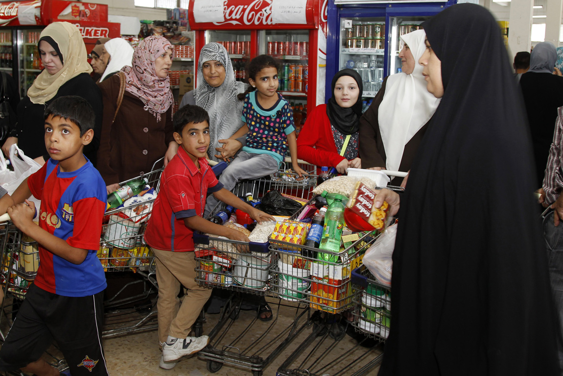 People stock up on food at the Civil Service Consumer Corporation in Amman, Jordan, in preparation for the fasting month of Ramadan Stocking up on food for Ramadan