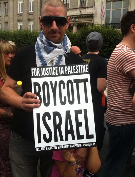 A protester holds an anti-Israel placard.