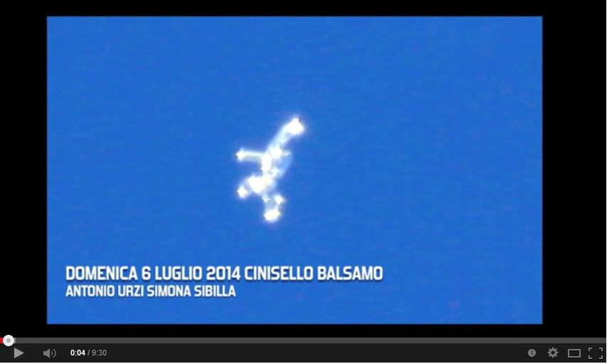 The YouTube image shows a suspected UFO flying over Milan, Italy. Huge UFO with Flashing Light Caught over Italy Sky