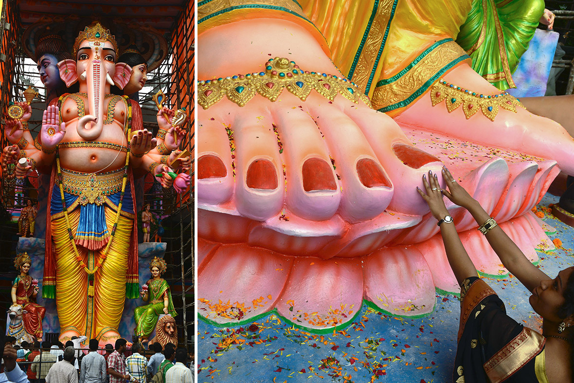 Hindus offer prayers in front of a 60ft (22m) tall idol of Lord Ganesh in Hyderabad