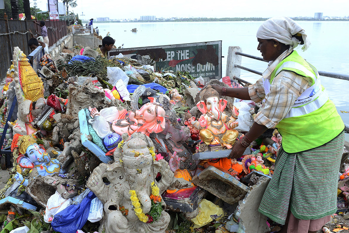 Workers remove statues of Lord Ganesh from the Hussain Sagar Lake in Hyderabad