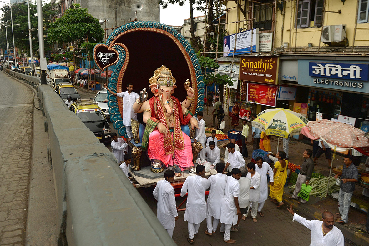 Hindus transport a huge idol of the elephant-headed Lord Ganesh towards the sea in Mumbai