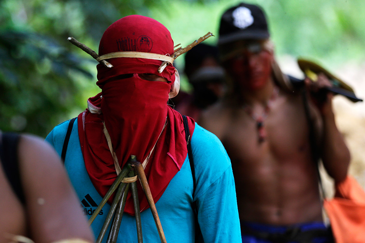Ka'apor warriors hike through the Amazon to search for and expel loggers