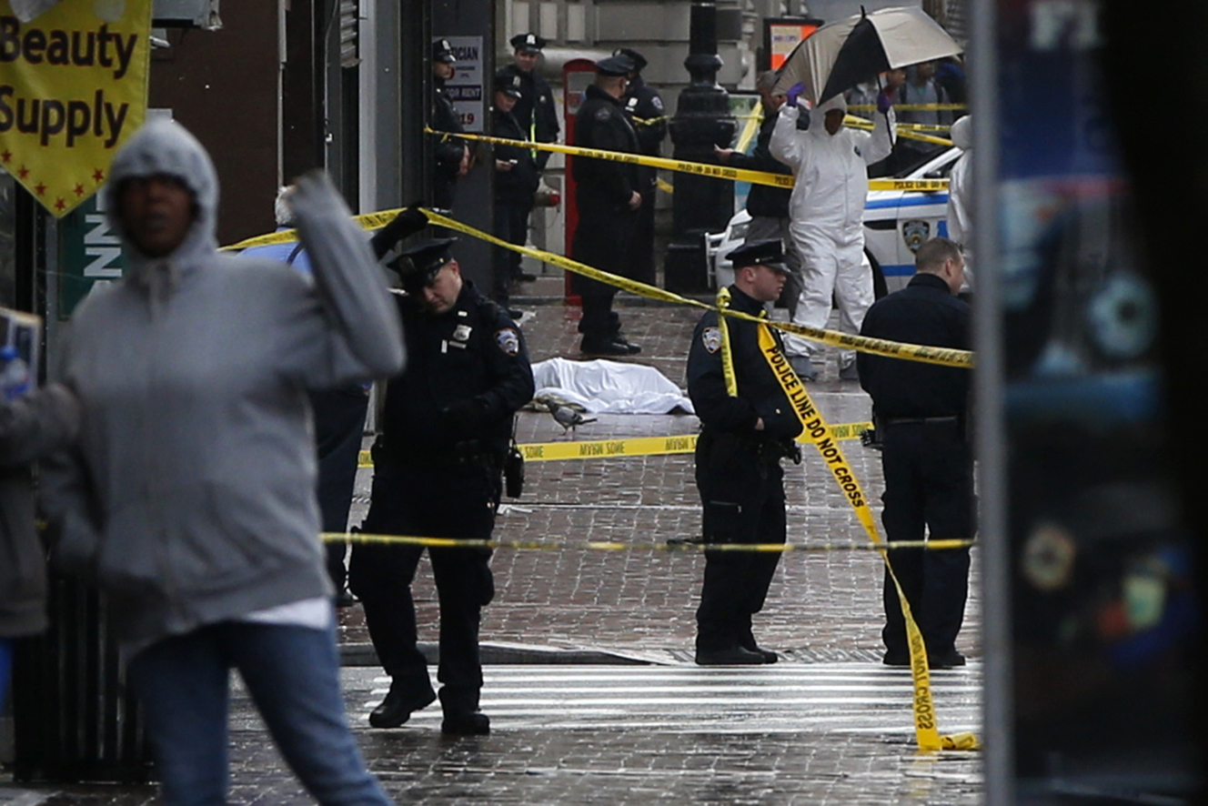 ... dead a man who attacked them with an axe inQueens, New York (Reuters