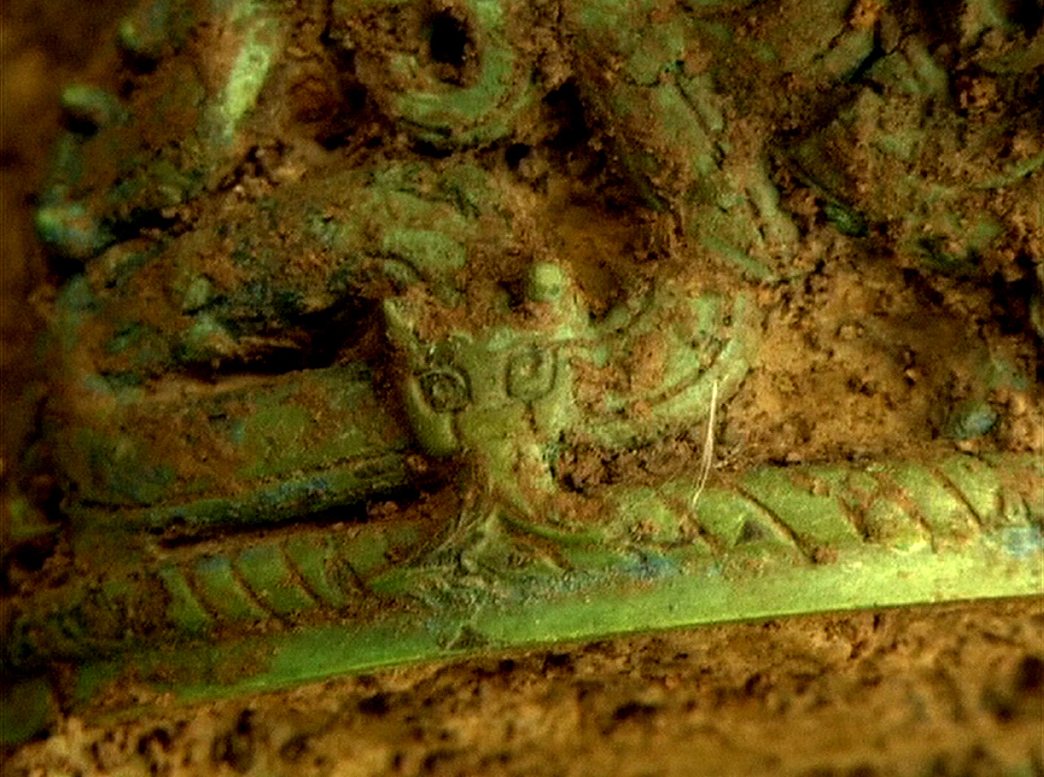 Close-up of the dragon on the pottery container unearthed from the tombs Close-up of the dragon on the pottery container unearthed from the tombs
