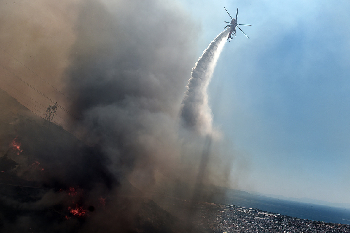 Greece Fire rages on the hills around Athens causing residents to flee