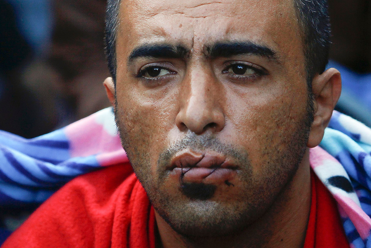 Macedonia Migrants refused entry sew their lips up in protest over