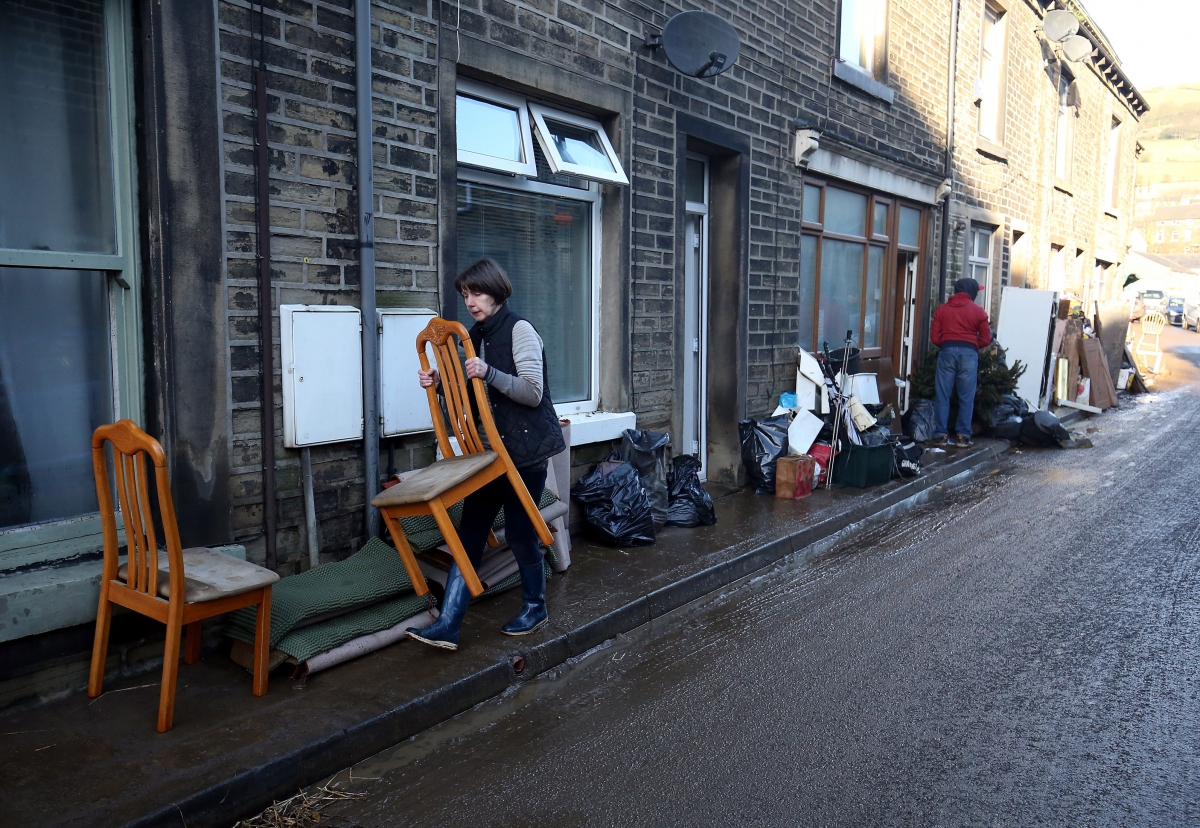 UK floods: Police and bikers join forces to protect homes from looters in West Yorkshire Looting-floods-mytholmroyd