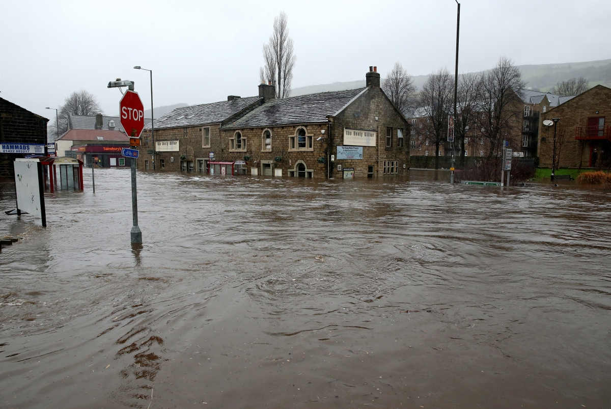 UK floods: Police and bikers join forces to protect homes from looters in West Yorkshire Mytholmroyd-flood