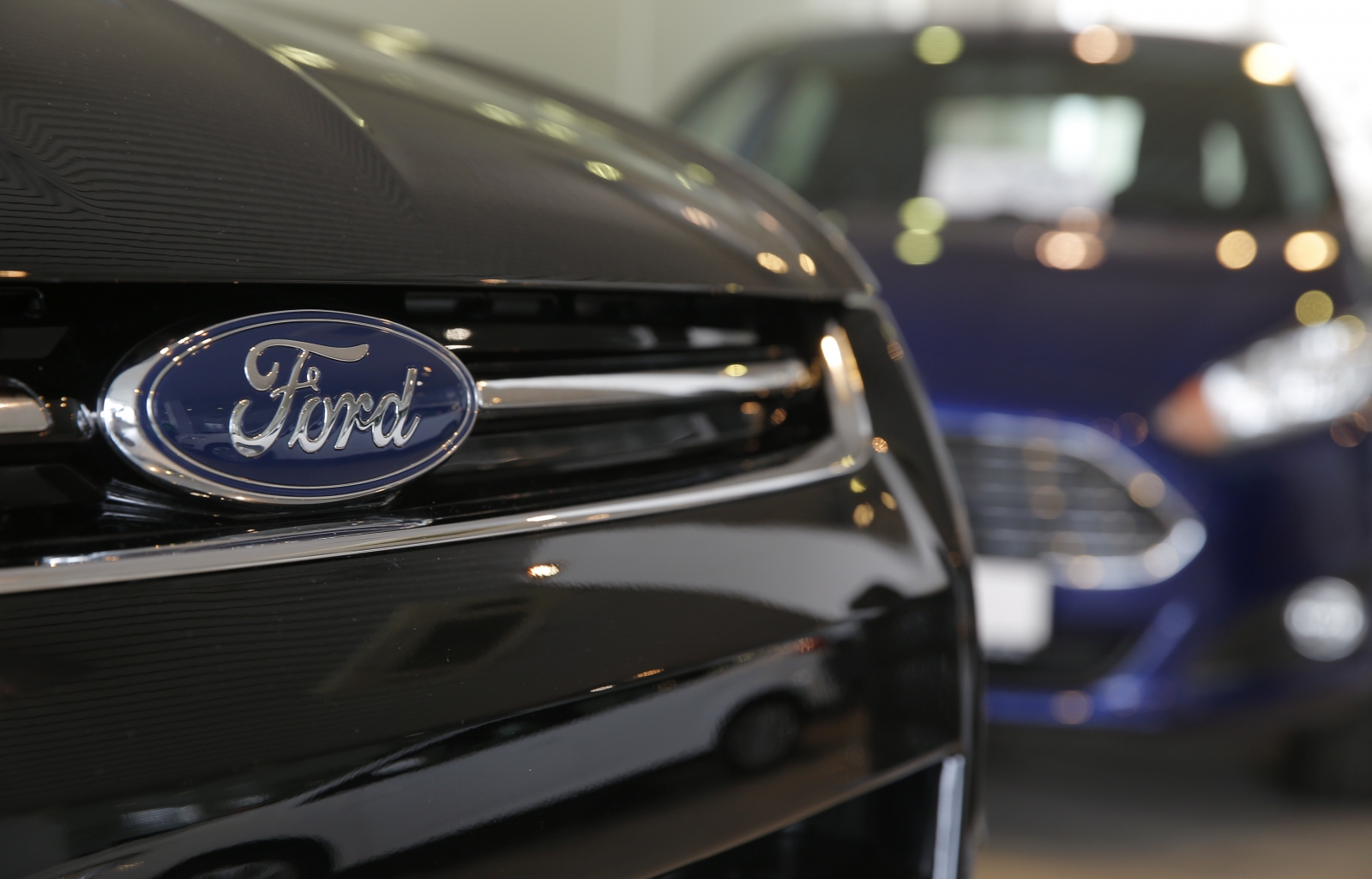 Ford recalls more than half a million cars over fears of engine fires and faulty doors