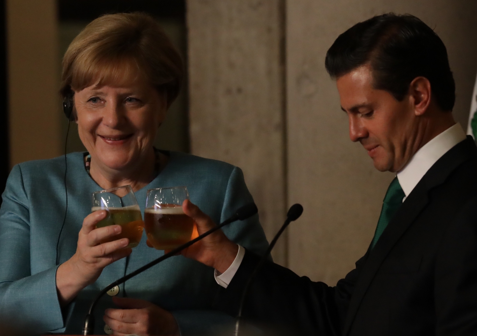 Angela Merkel pictured enjoying a drink as she urges May to get on with Brexit negotiations