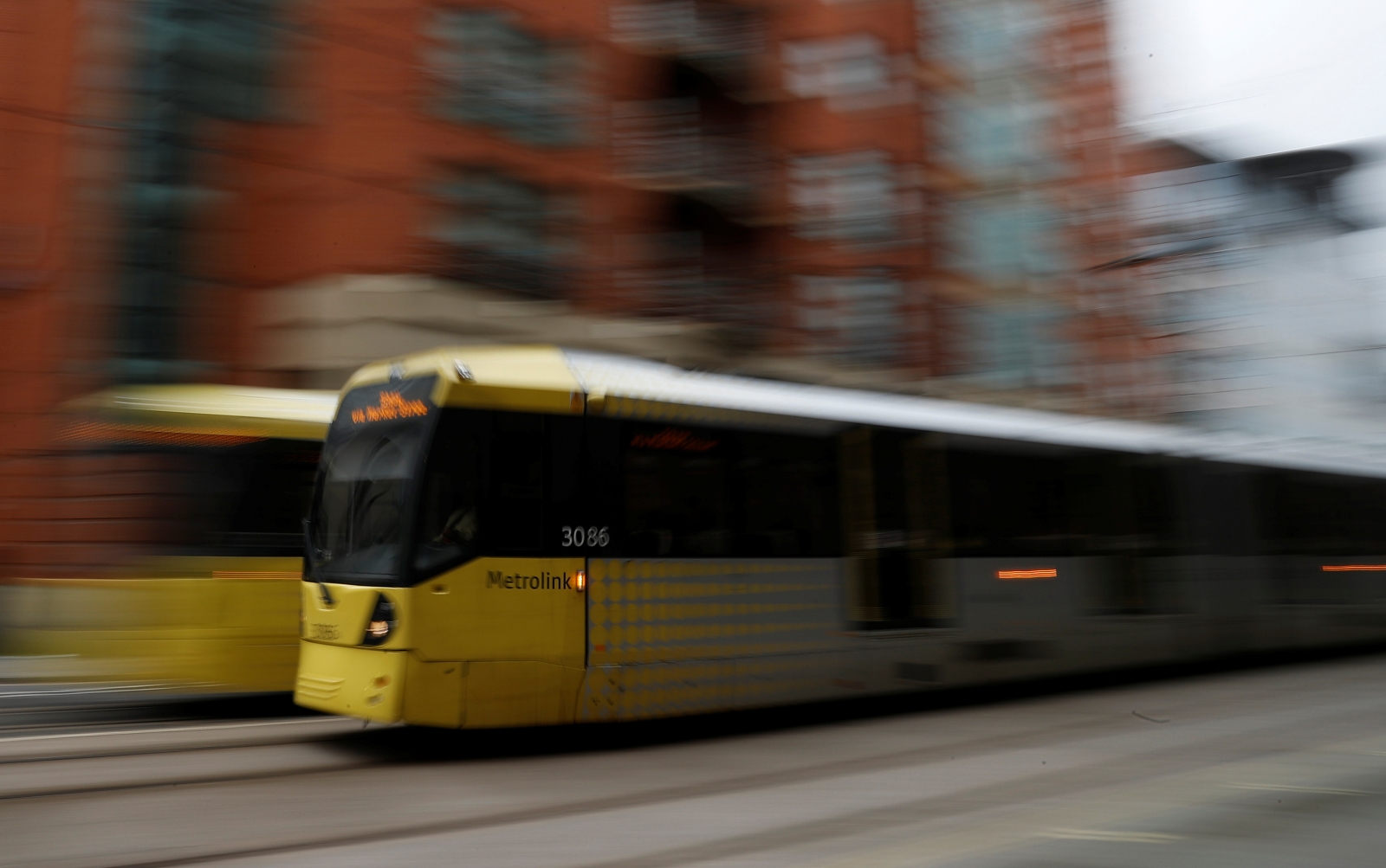 Woman charged with murder after man 'pushed in front of moving tram' in Manchester