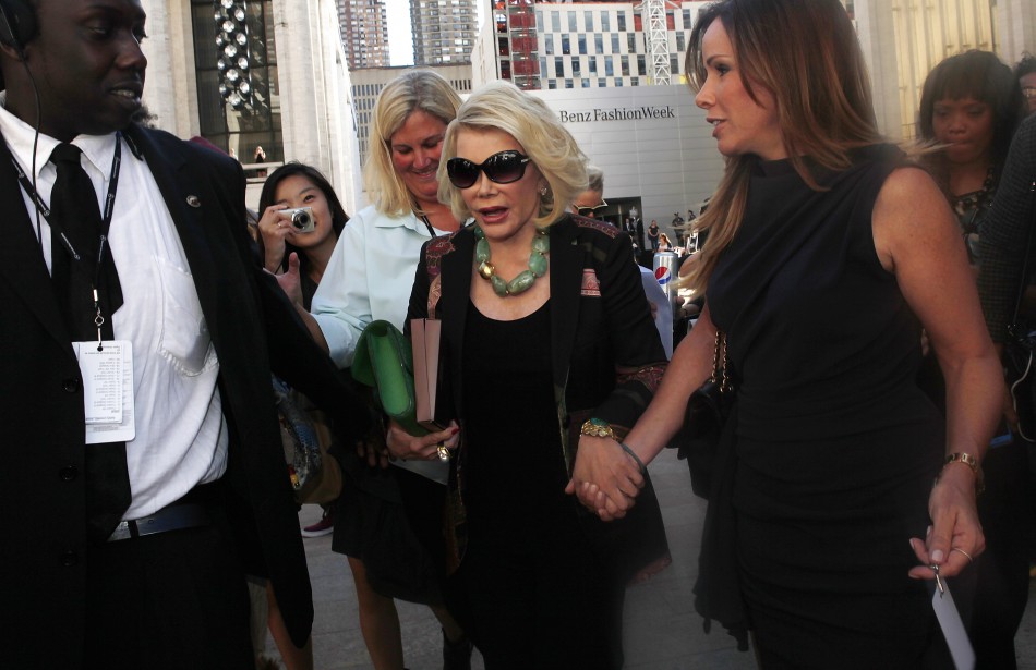 Joan Rivers and her daughter, Melissa, leave Avery Fisher Hall after the Chris Benz show at Mercedes-Benz Fashion Week Monday. Joan And Melissa Rivers