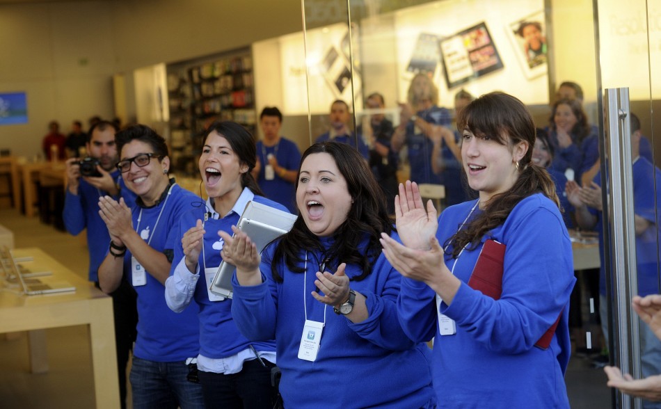 Apple employees celebrate the iPhone 5 sales launch in San Francisco