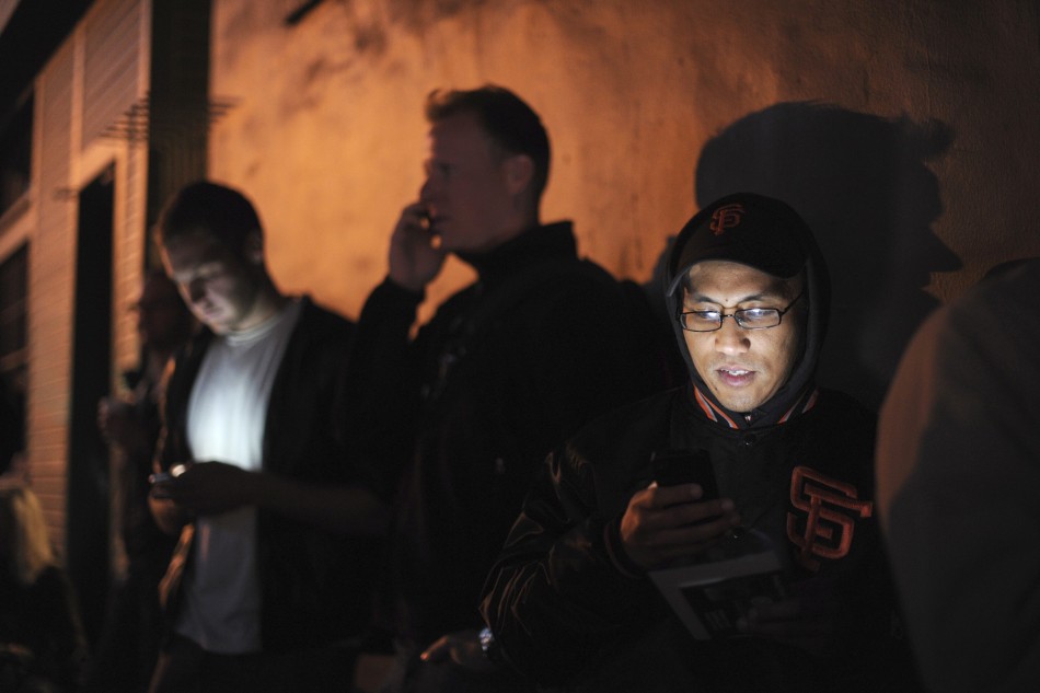 Frederick Laza joins several hundred people waiting to buy an iPhone 5 outside an Apple Store in San Francisco