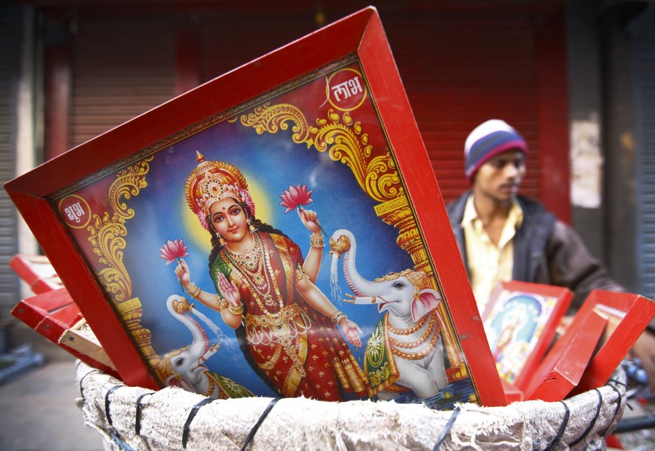 A poster of the Goddess of wealth Laxmi is seen for sale by a vendor along the streets of Kathmandu during the Tihar festival also called Diwali in Kathmandu. (Photo: Reuters)