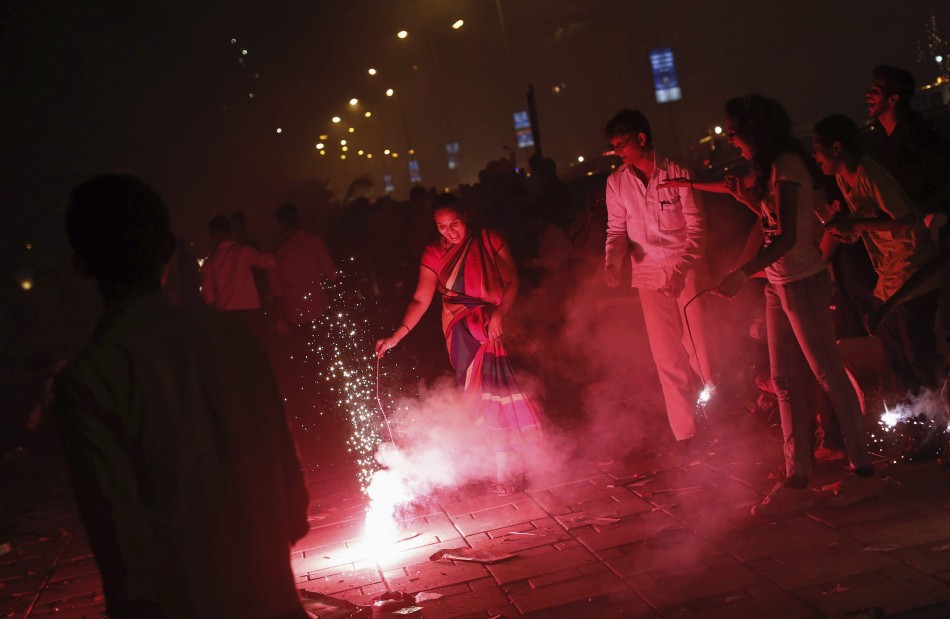 People burn crackers to celebrate Diwali in Mumbai. (Photo: Reuters)