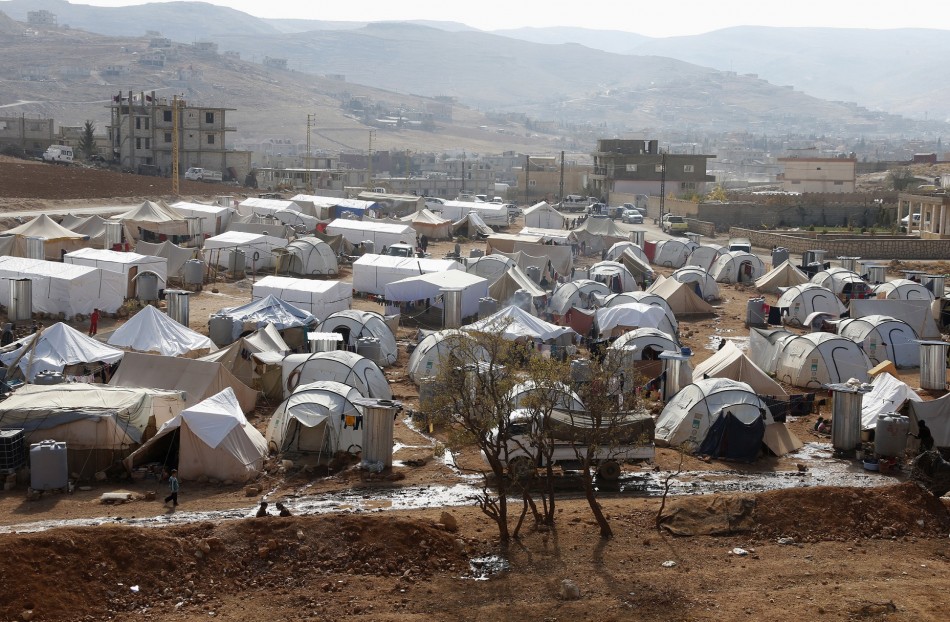 A general view shows tents of Syrian refugees at al-Shouhada camp at the Lebanese border town of Arsal, in the eastern Bekaa Valley - (Reuters) A general view shows tents of Syrian refugees at al-Shouhada camp at the Lebanese border town of Arsal, in the eastern Bekaa Valley - (Reuters)