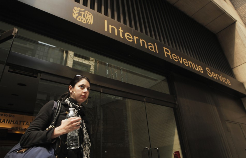 A woman walks out of an Internal Revenue Service office in New York April 18, 2011.