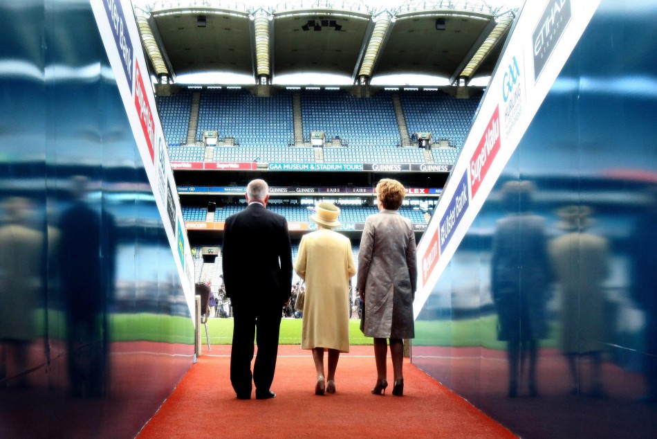 The Queen enters Croke Park stadium with Ireland039s President Mary McAleese and Gaelic Athletic Association President Christy Cooney.