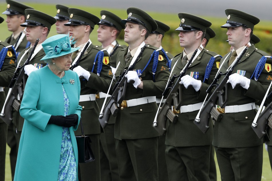 The Queen inspects a Guard of Honour at the residence of the Irish President in Dublin.