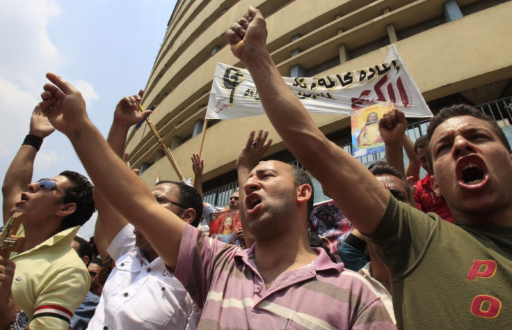 <="" a="" border="0"> Add to cart Add to lightbox (U2 Mexico) Download layout (Watermarked) Egyptian Christians chant slogans as they protest against recent attacks in front of the state television building in Cairo