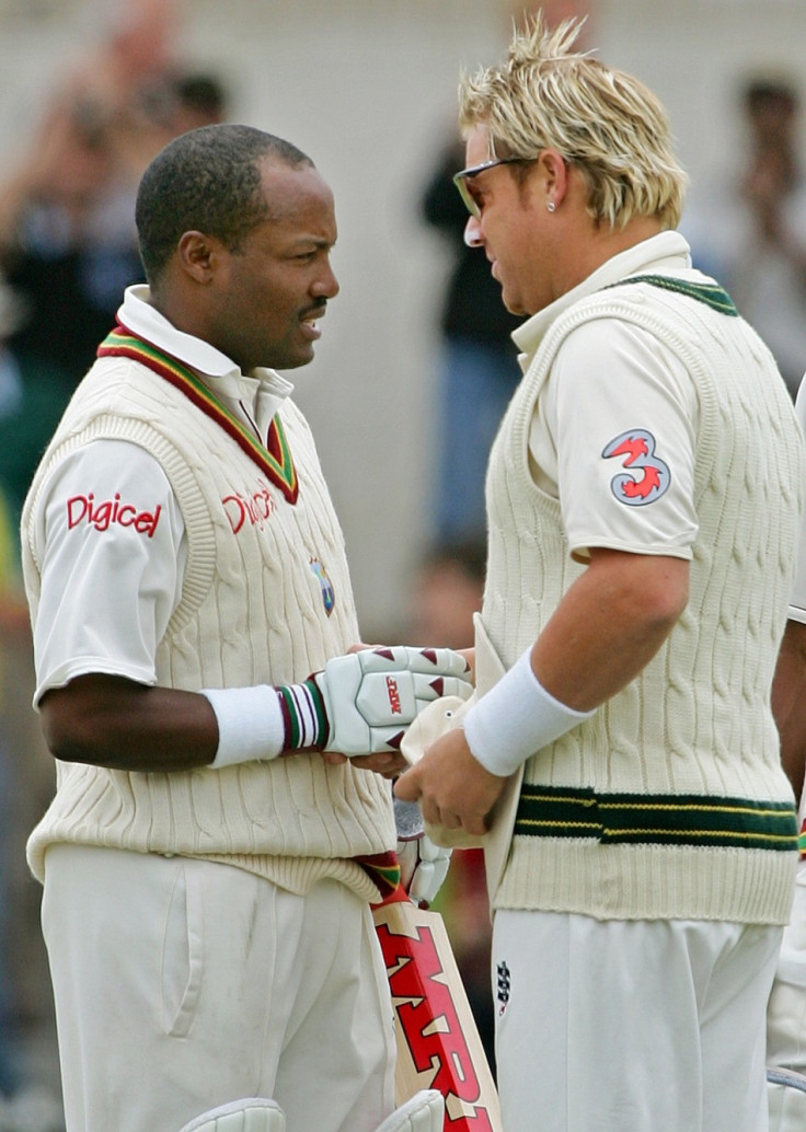 Warne congratulates West Indies&#039; Brian Lara. Warne is the game&#039;s second most prolific wicket taker.