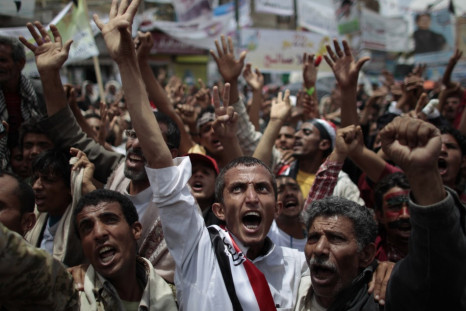 Anti-government protesters shout during a rally to demand the ouster of Yemen&#039;s President Saleh in Sanaa