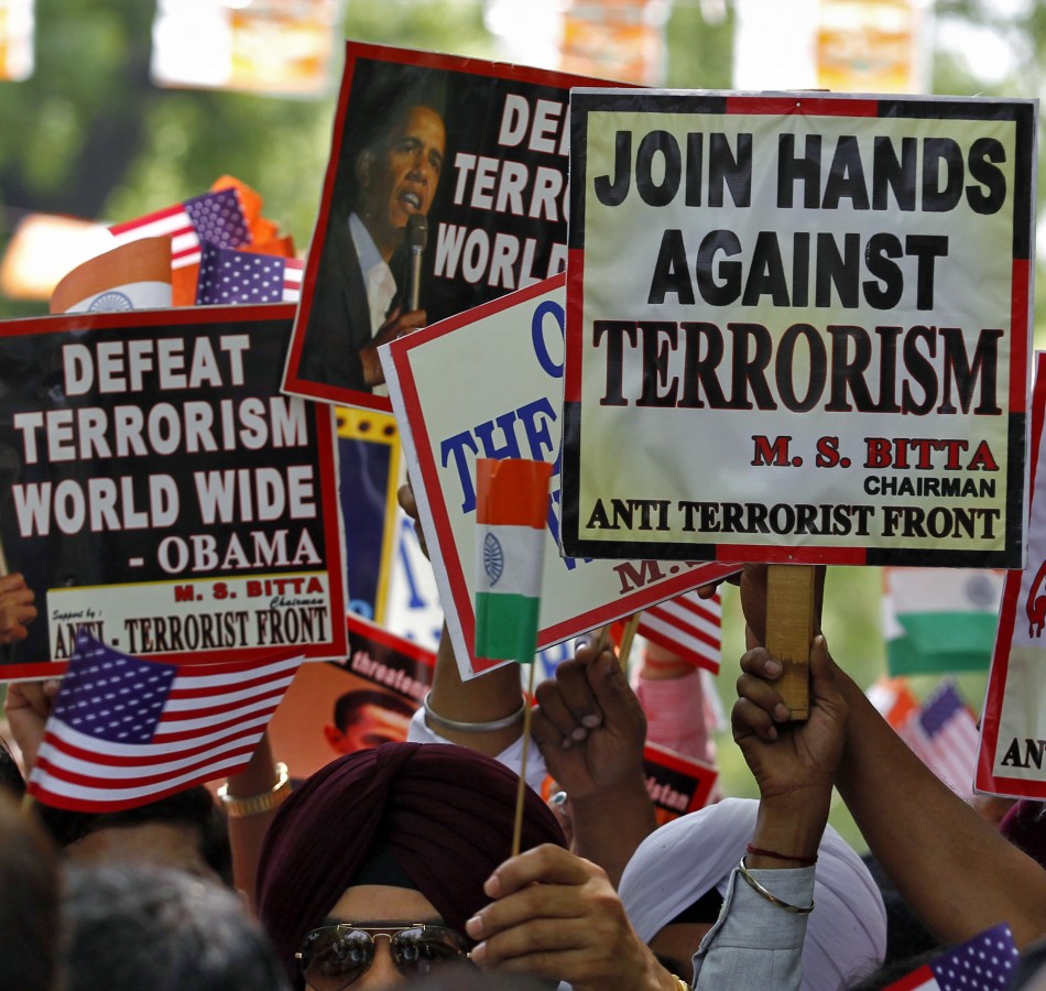 Members of AIATF hold placards in New Delhi