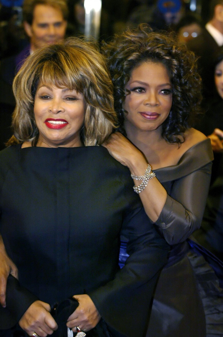 Talkshow host Oprah Winfrey (R) hugs singer Tina Turna