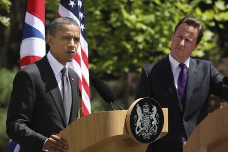 Britain's Prime Minister David Cameron listens as U.S. President Barack Obama speaks during a joint news conference at Lancaster House in London