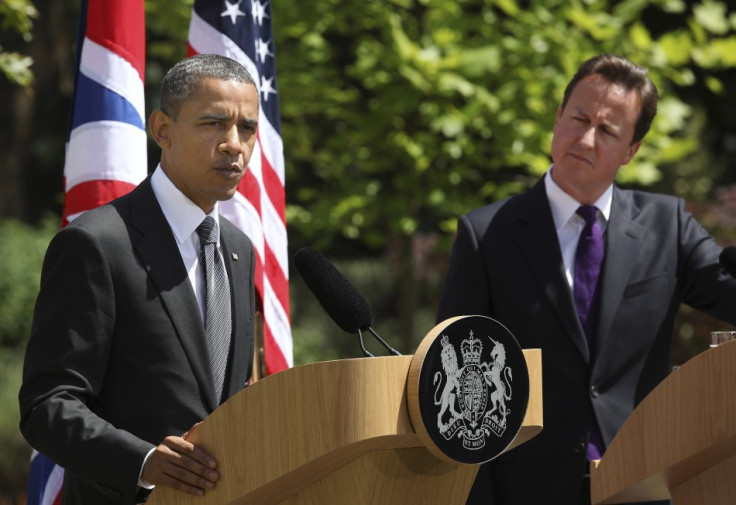 Britain&#039;s Prime Minister David Cameron listens as U.S. President Barack Obama speaks during a joint news conference at Lancaster House in London