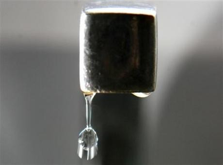 Water falls from a tap