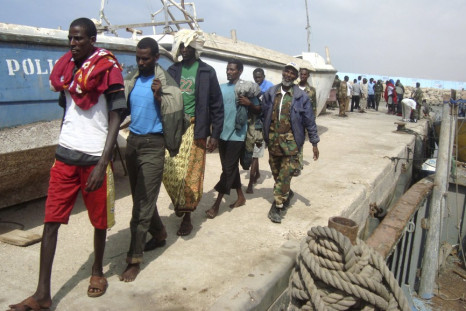 Puntland Marine Forces escort suspected Somali pirates captured by French forces in the Gulf of Aden, at the northern port town of Bosasso