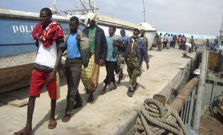 Puntland Marine Forces escort suspected Somali pirates captured by French forces in the Gulf of Aden, at the northern port town of Bosasso