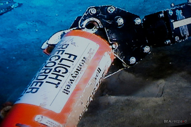 A mechanical arm, seen in this image published on the web site of France&#039;s BEA air accident inquiry office May 1, 2011, show the orange cylindrical flight data recorder above the sand