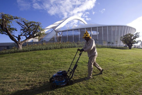 A gardener mows the grass at the Moses Mabhida Stadium in Durban