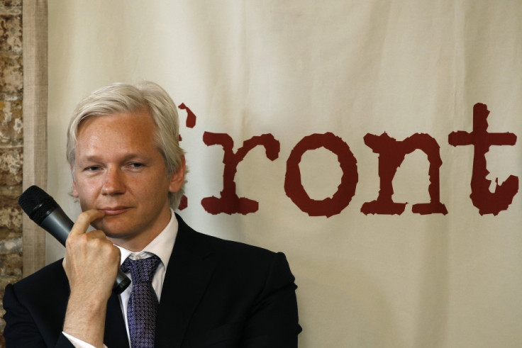 WikiLeaks founder Julian Assange listens during a news conference at the Frontline Club in London