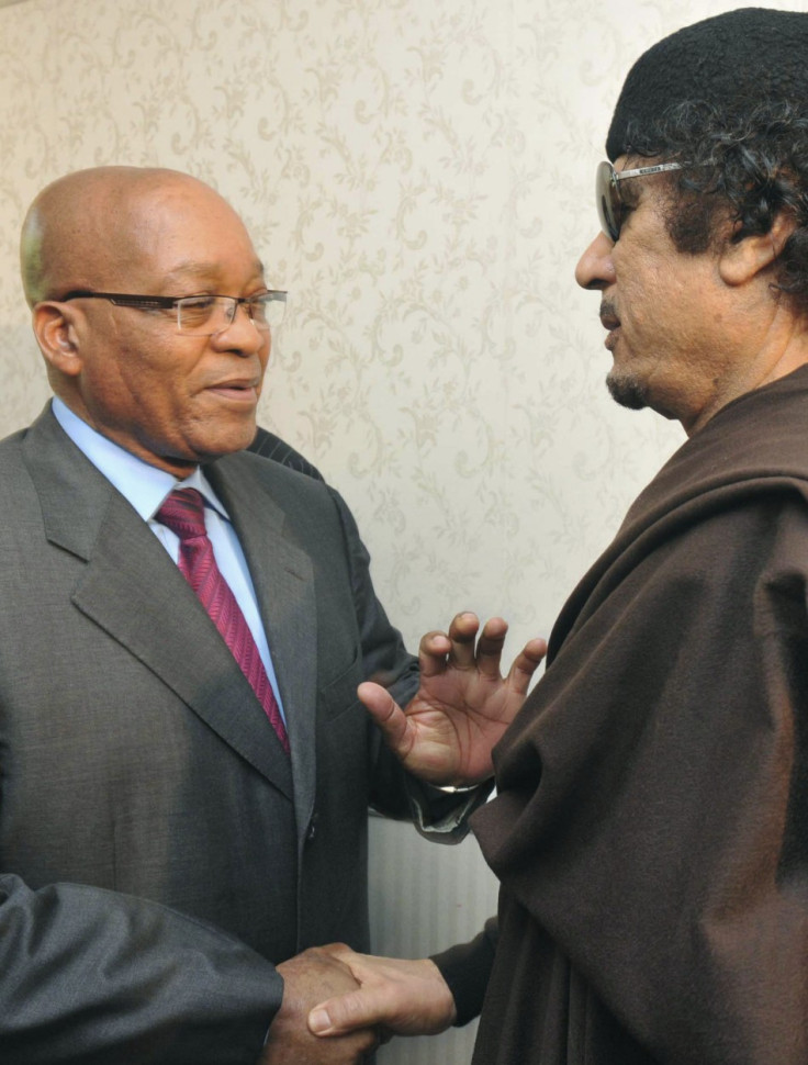 South Africa&#039;s President Jacob Zuma greets Libyan leader Muammar Gaddafi before their meeting in Tripoli