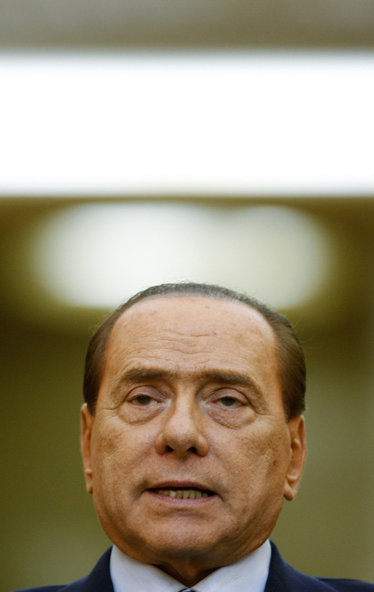 taly's Prime Minister Berlusconi addresses the media during a joint news conference with Romania's Prime Minister Boc at Victoria Palace in Bucharest