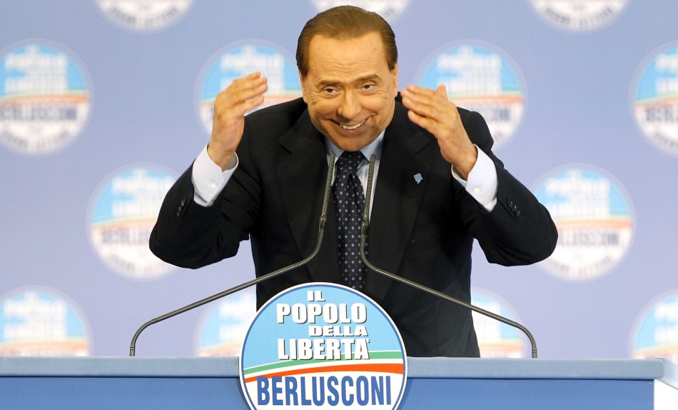 Silvio Berlusconi gestures during a party meeting to support Naples mayoral candidate, Gianni Lettieri, in Naples